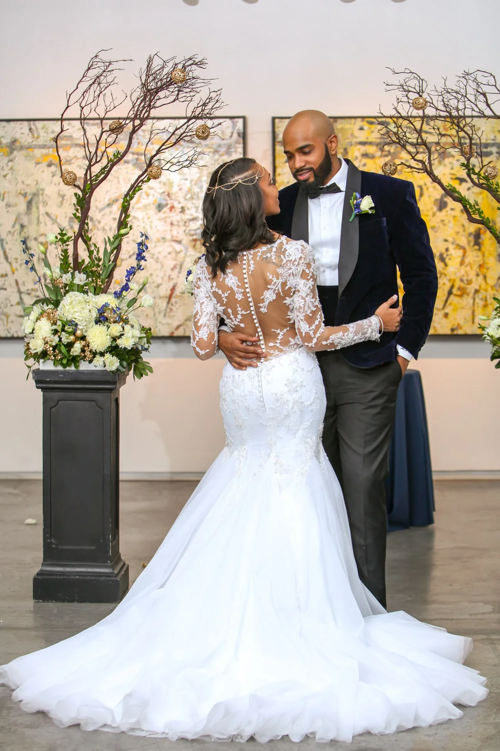Newlyweds embracing in a beautifully styled reception
